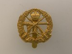 British Army Small Arms School Corps metal cap or beret badge.
