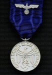 German Army or Heer 4 Year Long Service Medal with metal ribbon device.