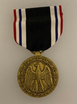U.S.  P.O.W. medal with ribbon bar in Issue Box.